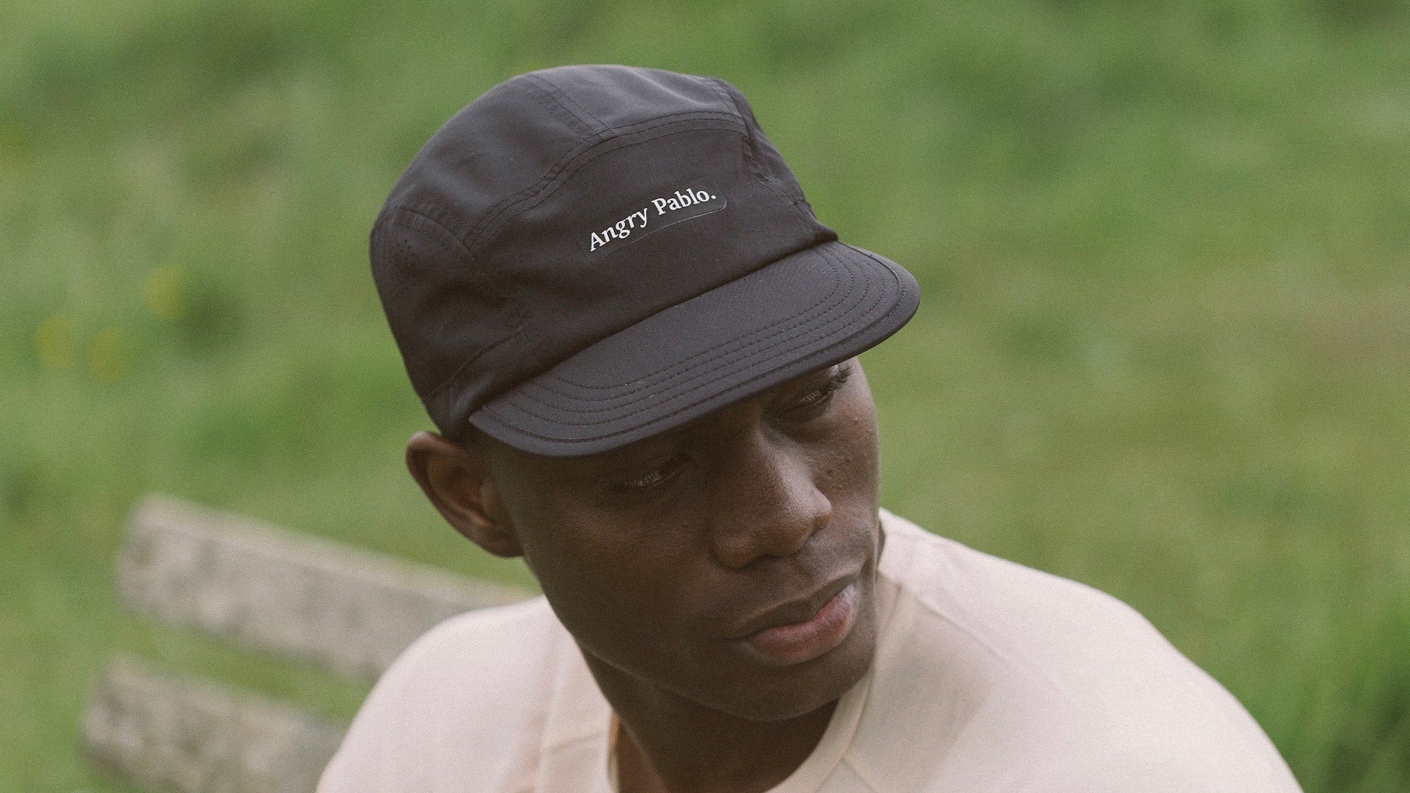 A runner wearing an Angry Pablo Tech Cap
