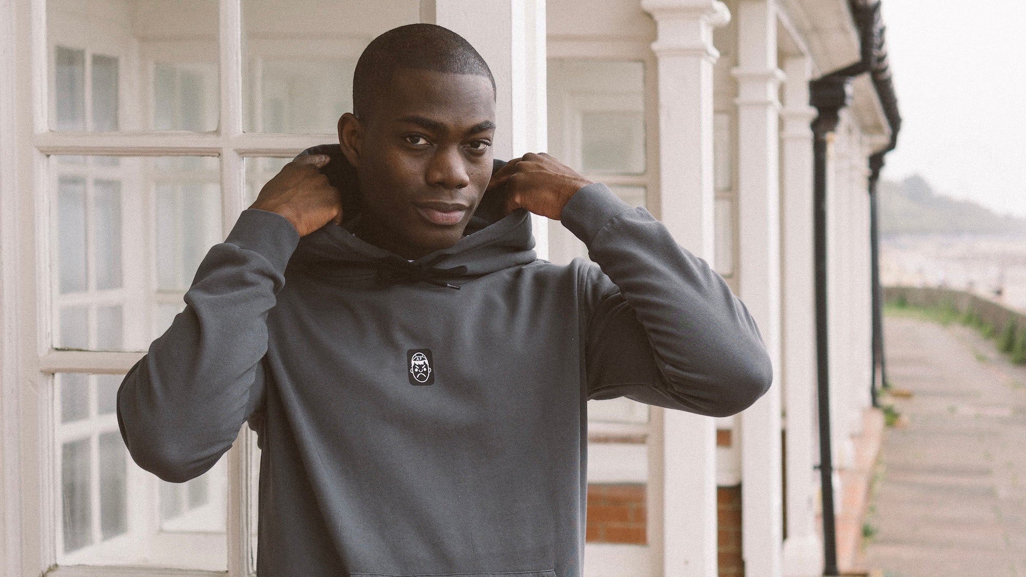 A model wearing an Angry Pablo hoodie