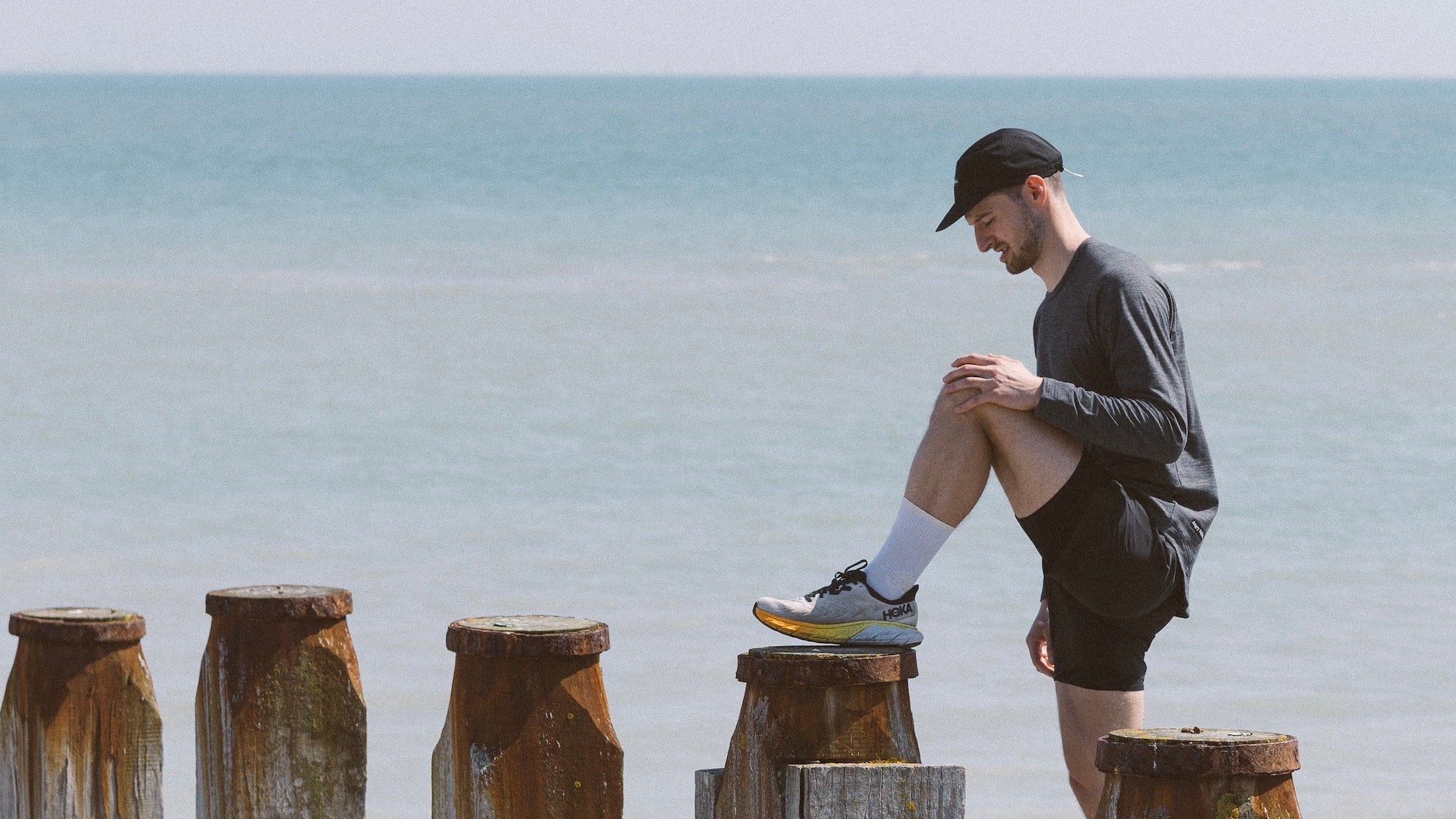 Runner stretching in Angry Pablo workout clothes