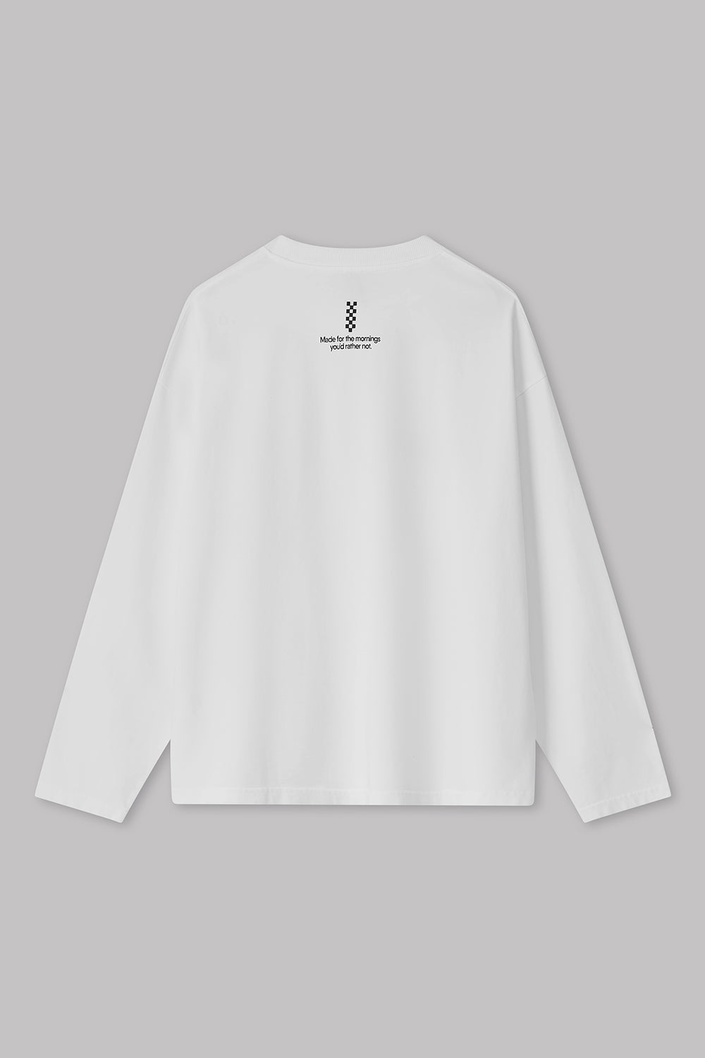 White long-sleeve shirt with a small logo on the chest against a gray background