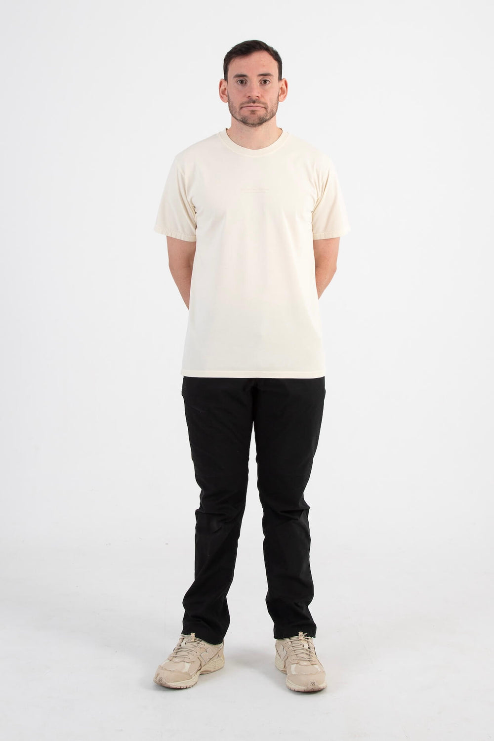 Model standing in a studio wearing an Angry Pablo t-shirt