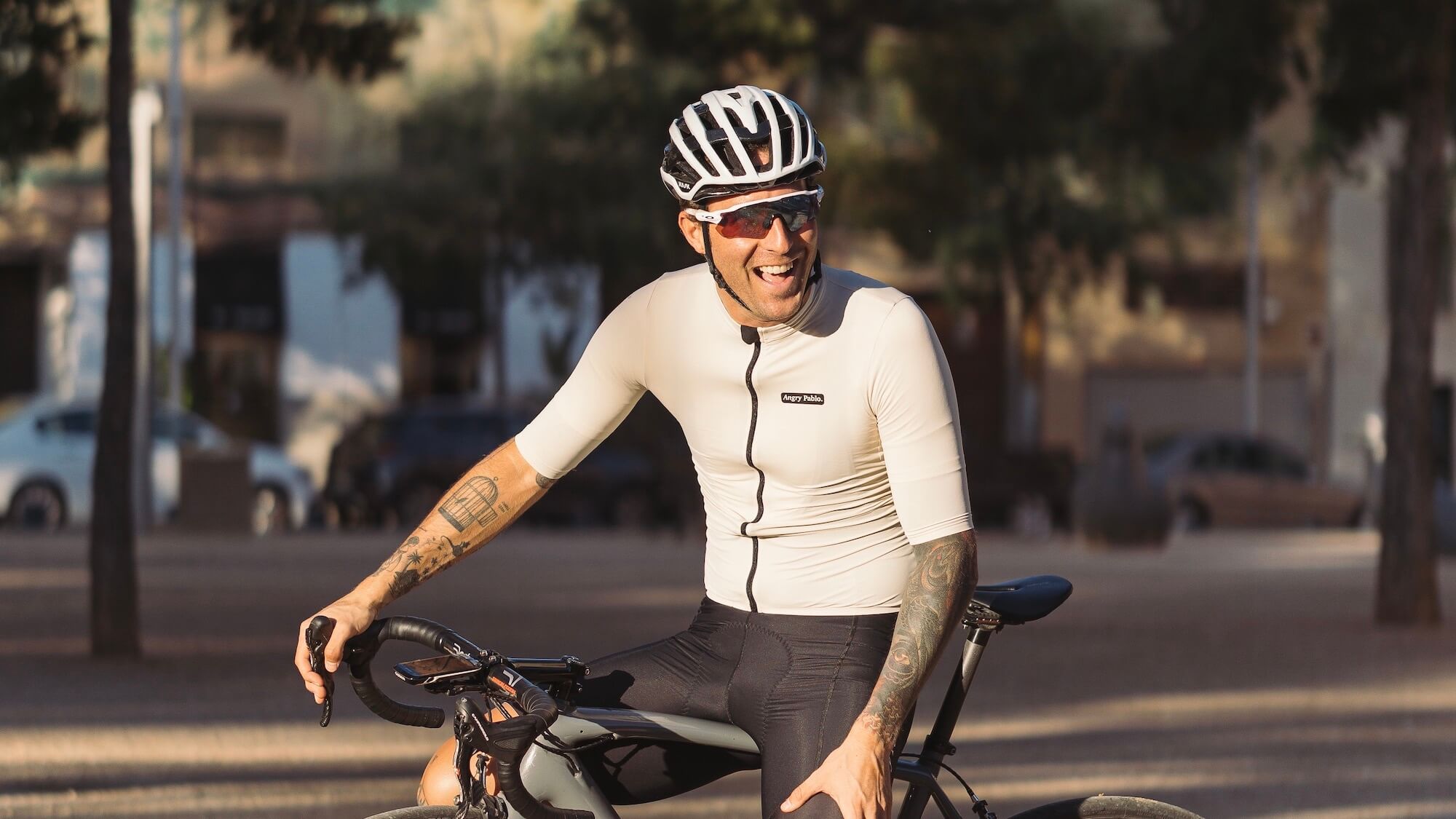 A laughing cyclist in Angry Pablo cycling clothes