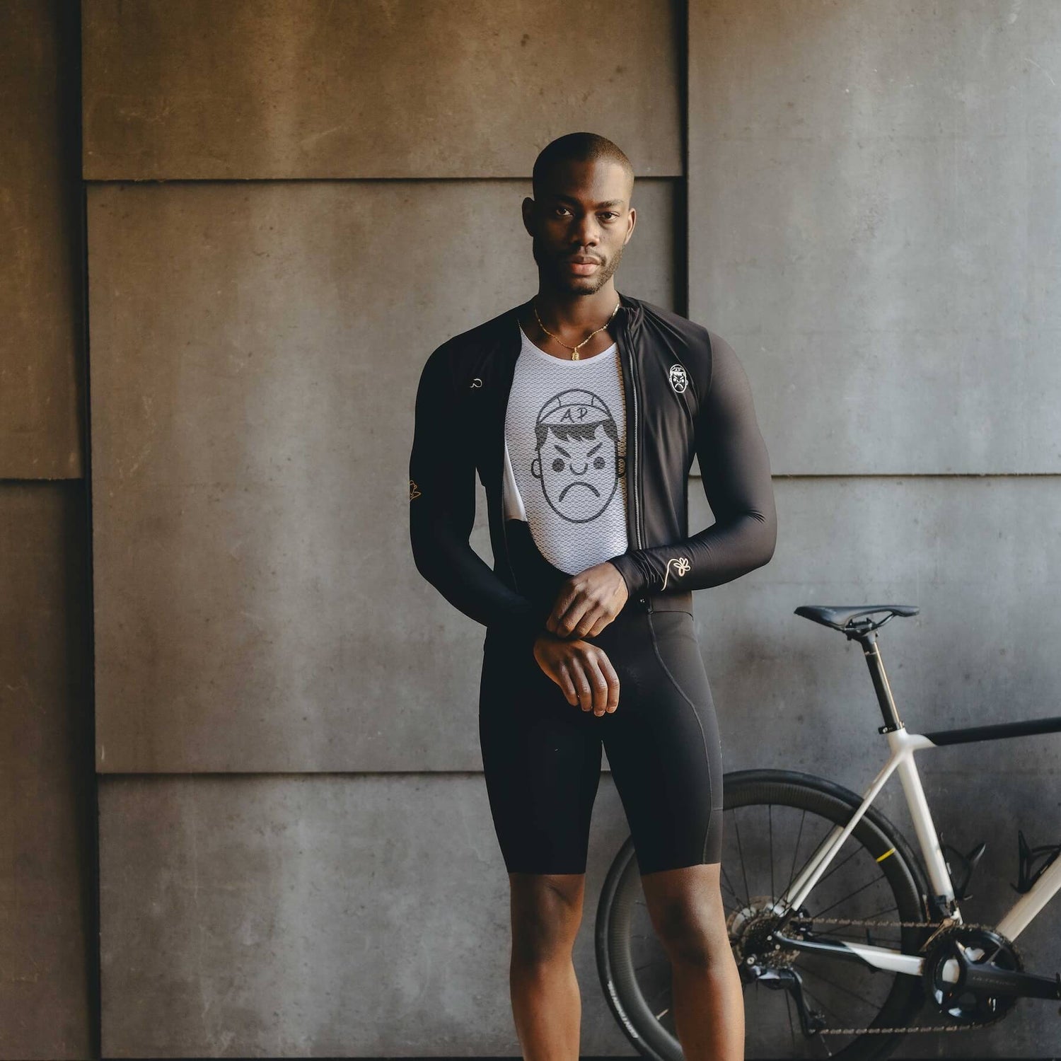 A male model wearing Angry Pablo a lightweight cycling base layer and long sleeve cycling jersey