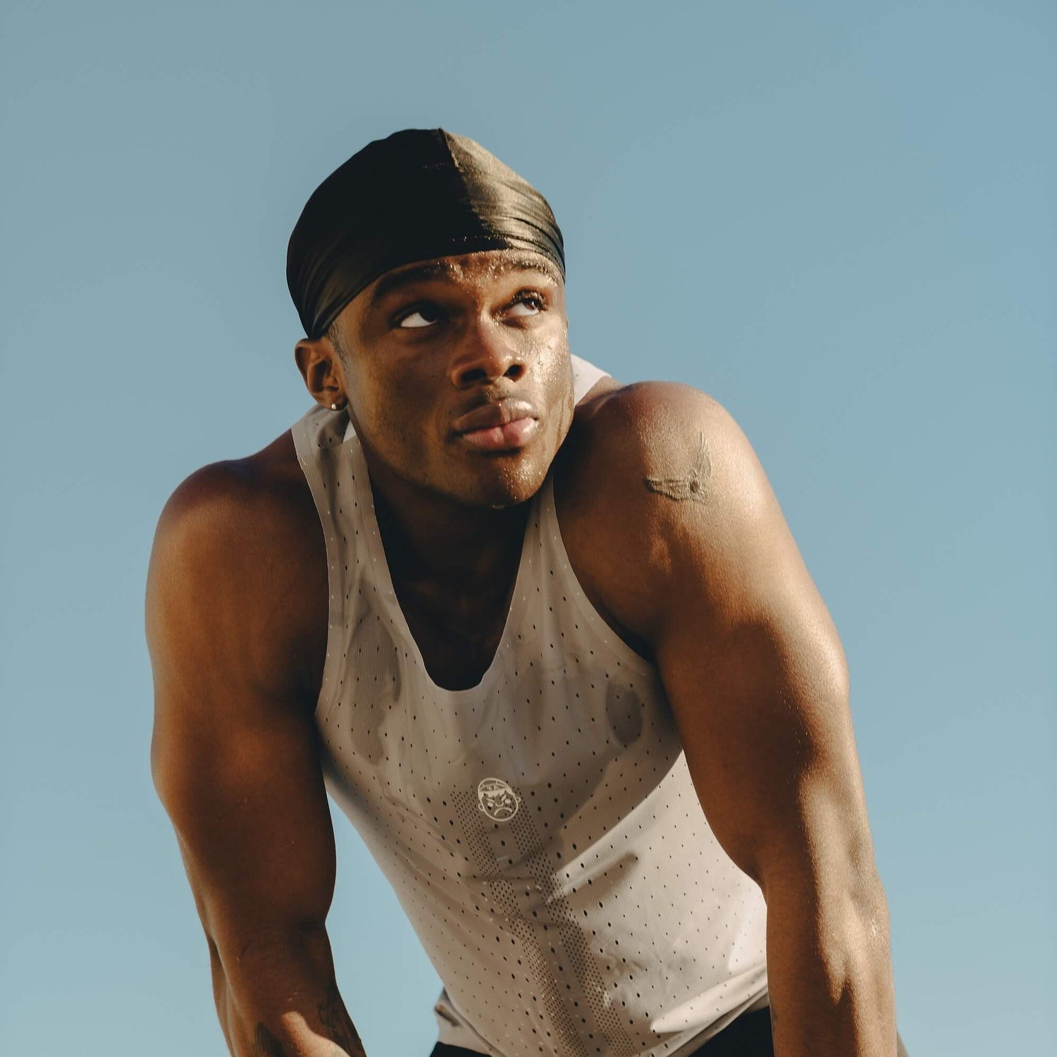 A man wearing a Angry Pablo running singlet