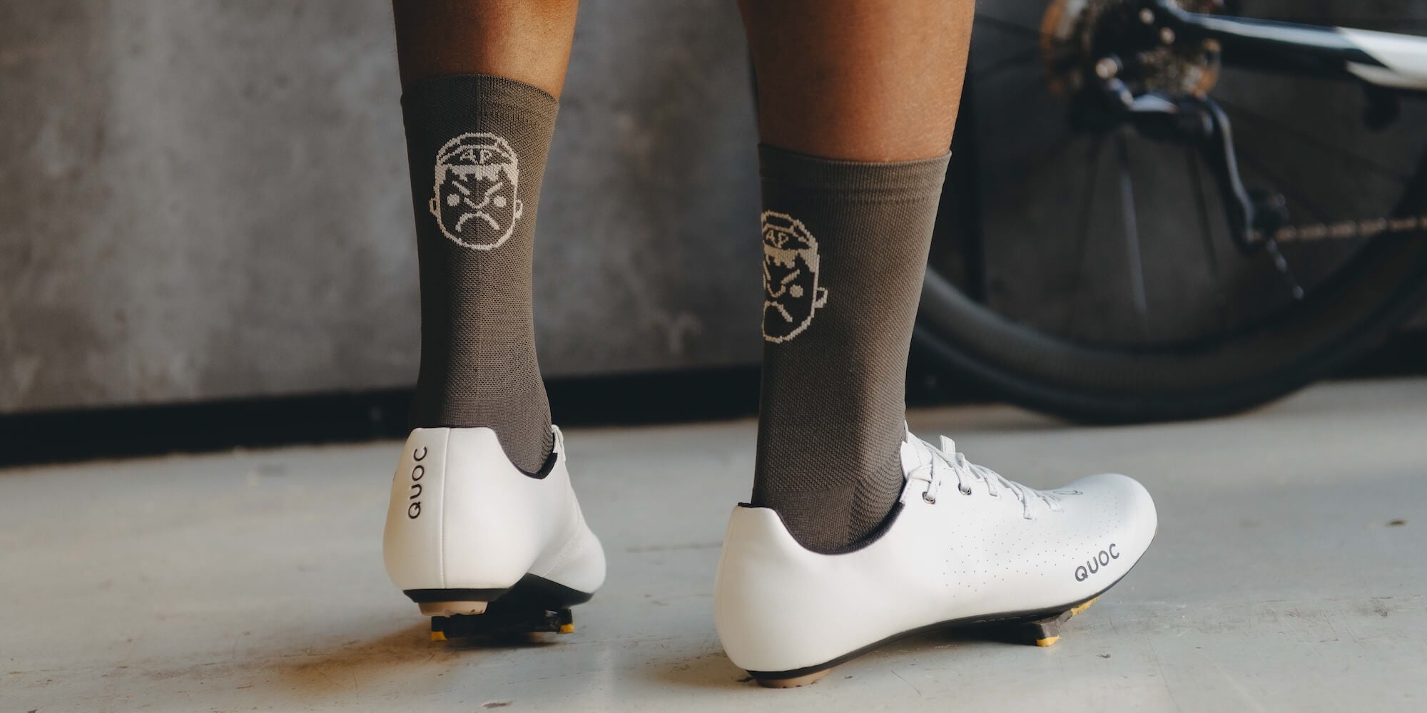 Back profile of Angry Pablo grey cycling socks