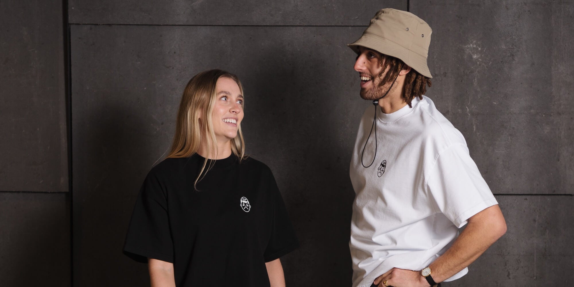 A male and female model wearing Angry Pablo heavyweight oversize t-shirts