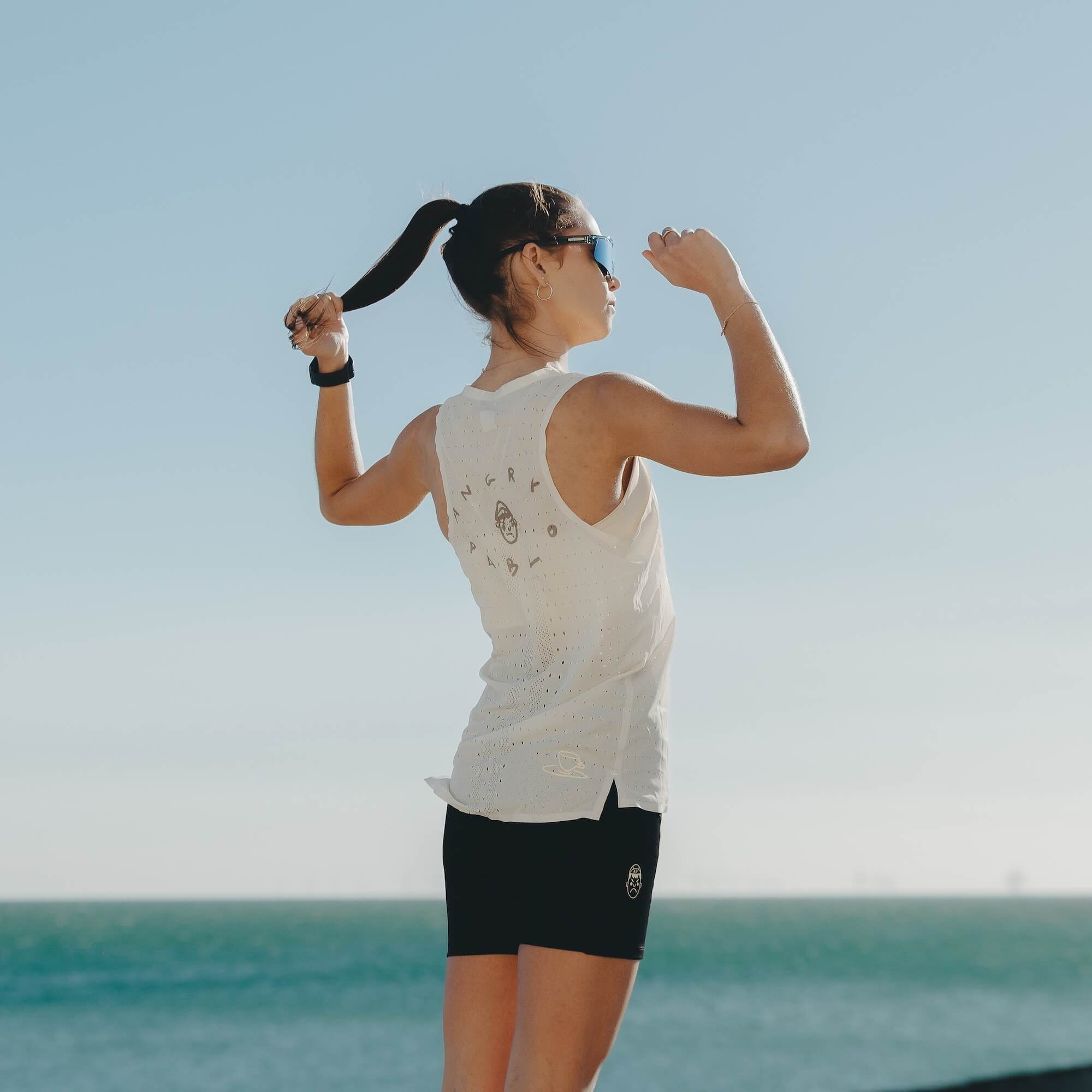 A woman wearing Angry Pablo female running clothing