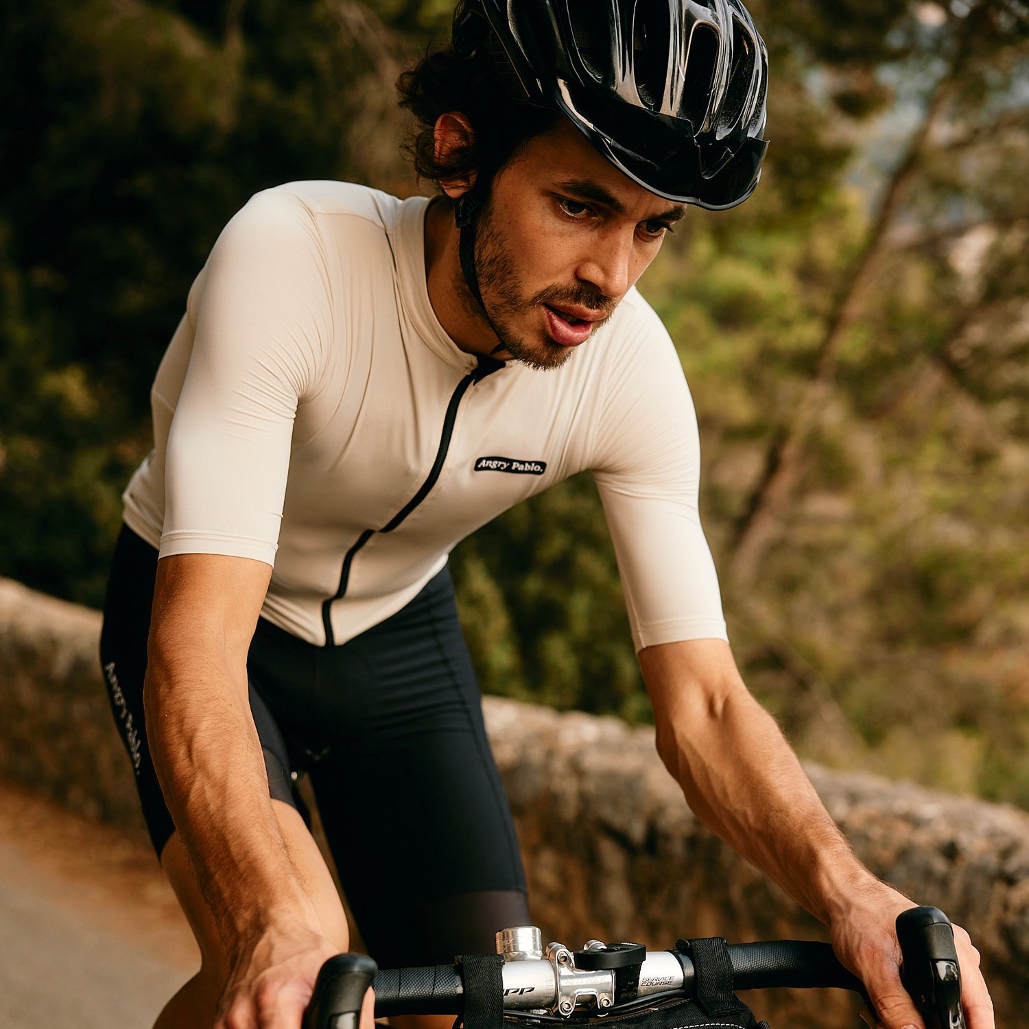 A cyclist riding in Angry Pablo clothing
