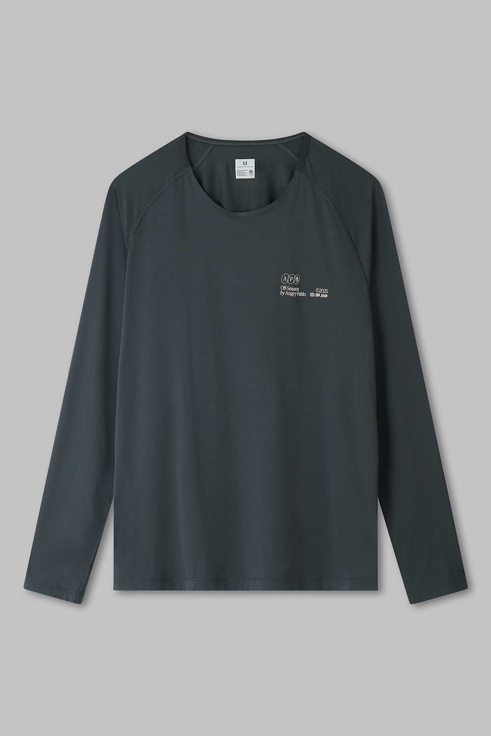 Black long-sleeve shirt with a logo on a gray background
