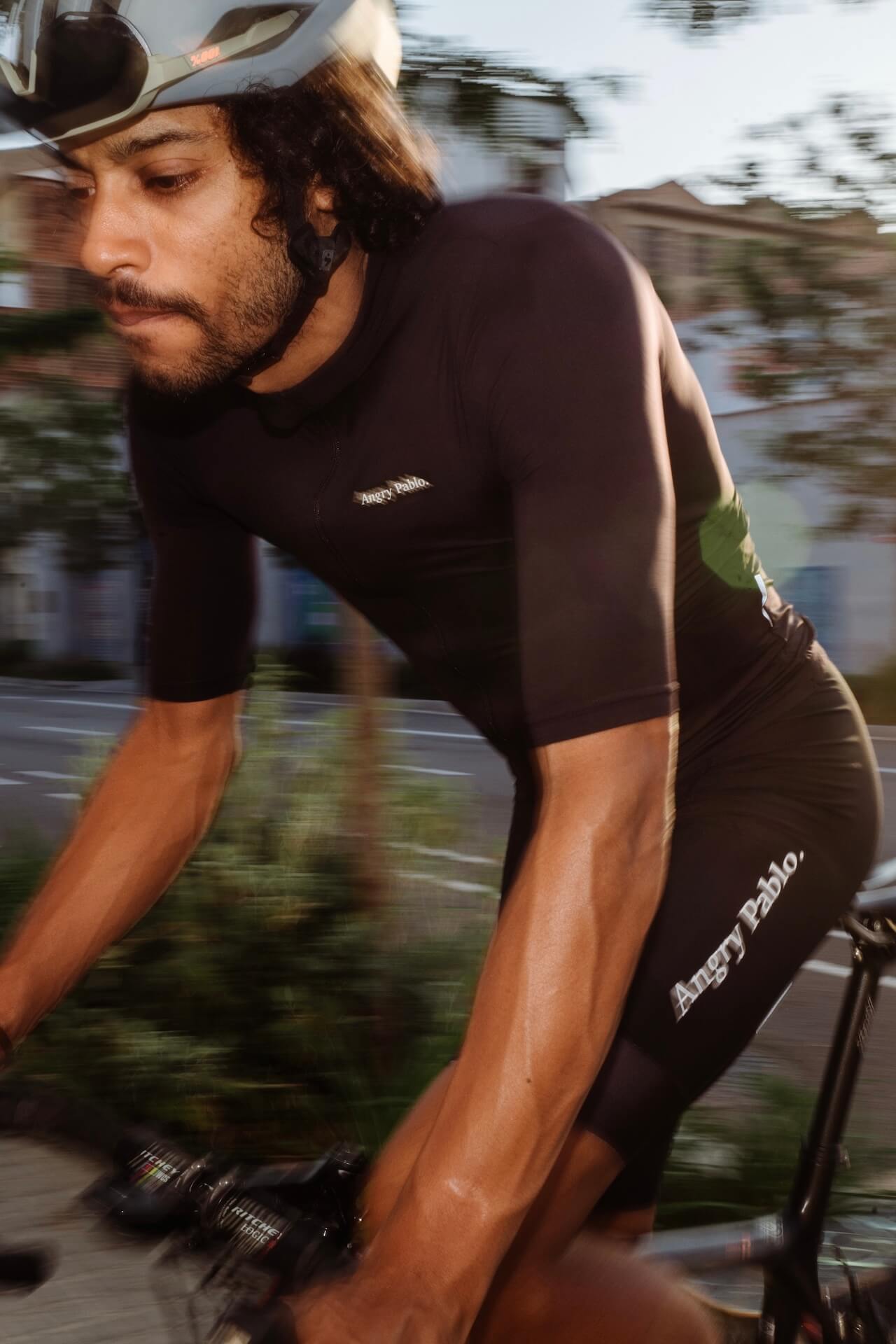 a cyclist riding in the angry pablo riding clothing