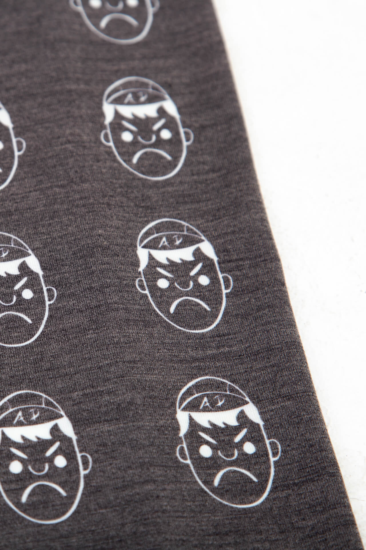 close up of grey wool angry pablo neck warmer